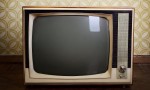 http://www.shutterstock.com/de/pic-132384326/stock-photo-retro-tv-with-wooden-case-in-room-with-vintage-wallpaper-and-parquet.html