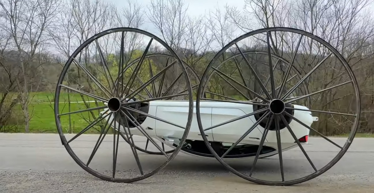 Youtuber builds Tesla 3-meter wagon wheels – and drives them upside down
